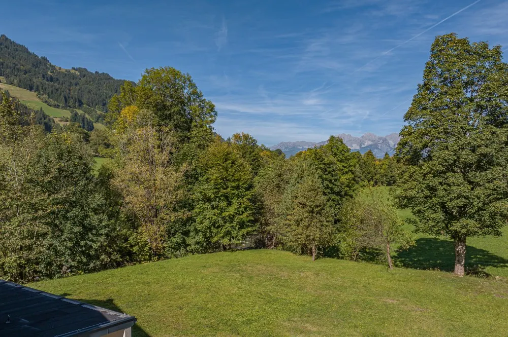 KITZIMMO-Baugrundstück mit Baugenehmigung in Aurach bei Kitzbühel.