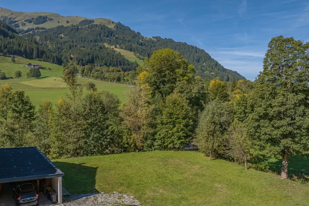 KITZIMMO-Baugrundstück mit Baugenehmigung in Aurach bei Kitzbühel.