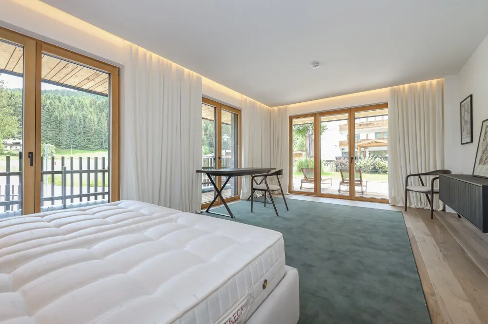 KITZIMMO-Riverside - Luxus-Garden-Suite in Toplage kaufen - Immobilien Kirchberg.