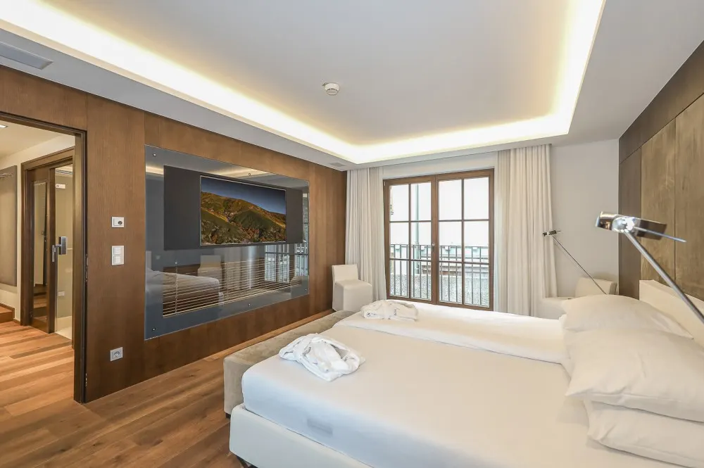 KITZIMMO-Luxus-Suite mit Zugang in ein 5-Sterne-Hotel - Immobilien Kitzbühel.