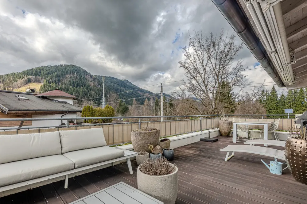 KITZIMMO-Hochwertige Haushälfte am Golfplatz kaufen - Immobilien Kitzbühel.