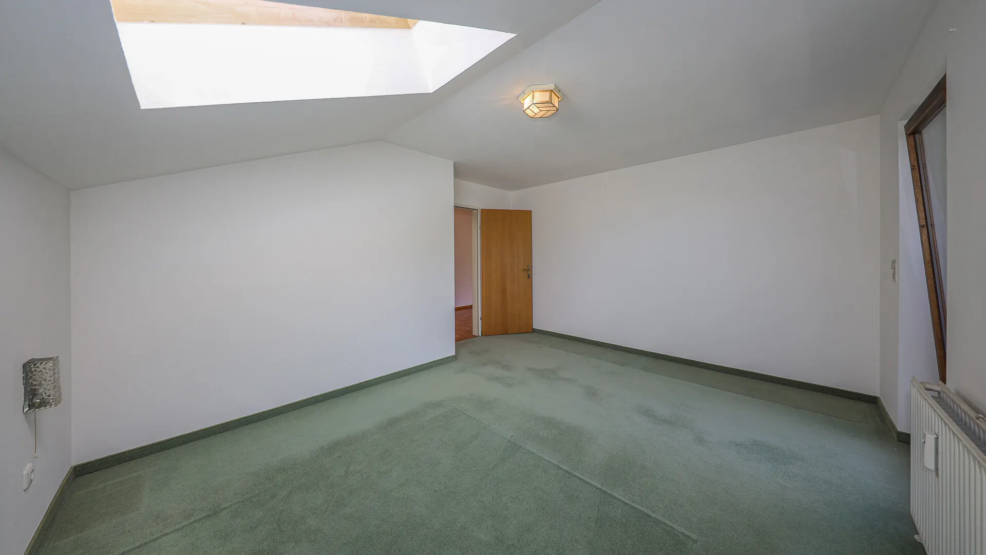 KITZIMMO-Dachgeschosswohnung in Ruhelage mit Kaiserblick kaufen - Immobilien Oberndorf.